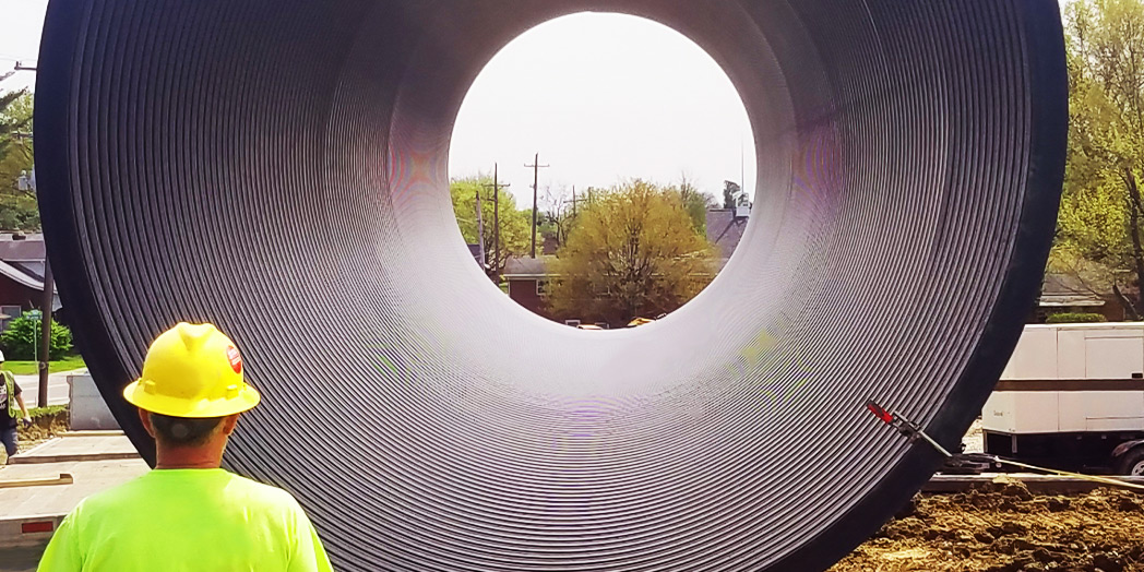 Worker looking into basin