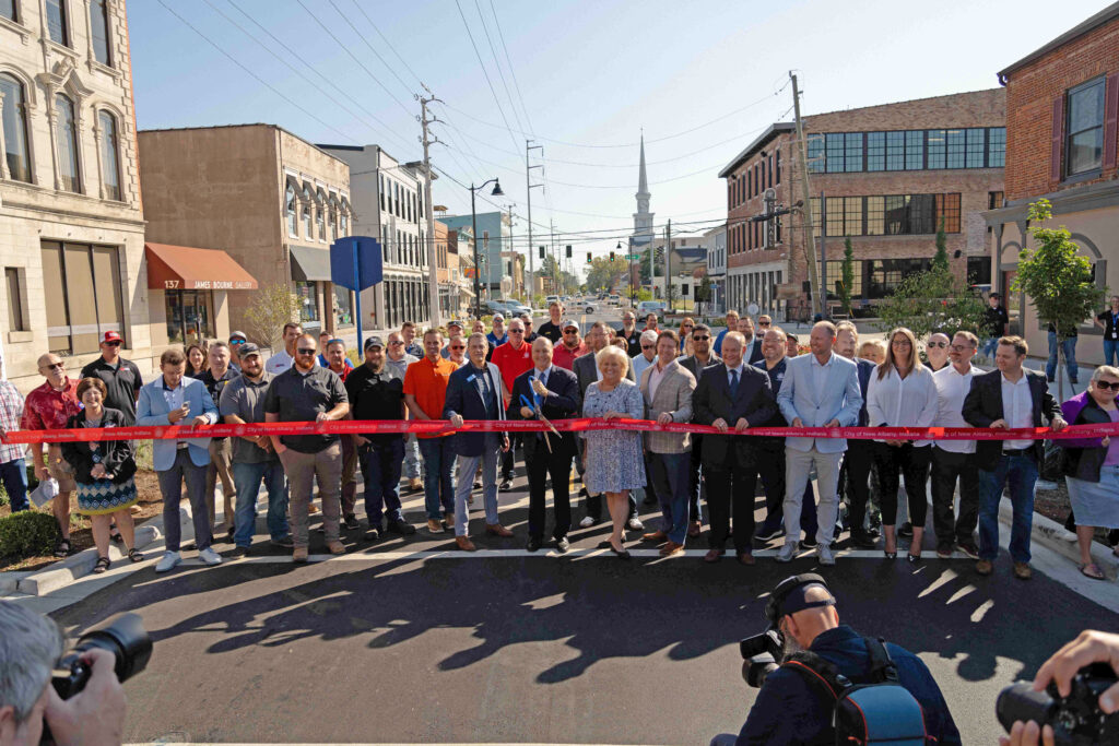 New Albany Main Street Revitalization Ribbon Cutting showing members of the community, government, and clark dietz. the mayor is about to cut the ribbon
