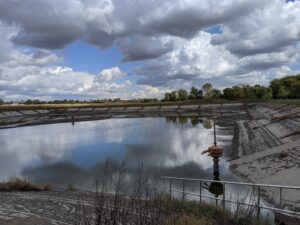 Large pond with a pump structure.