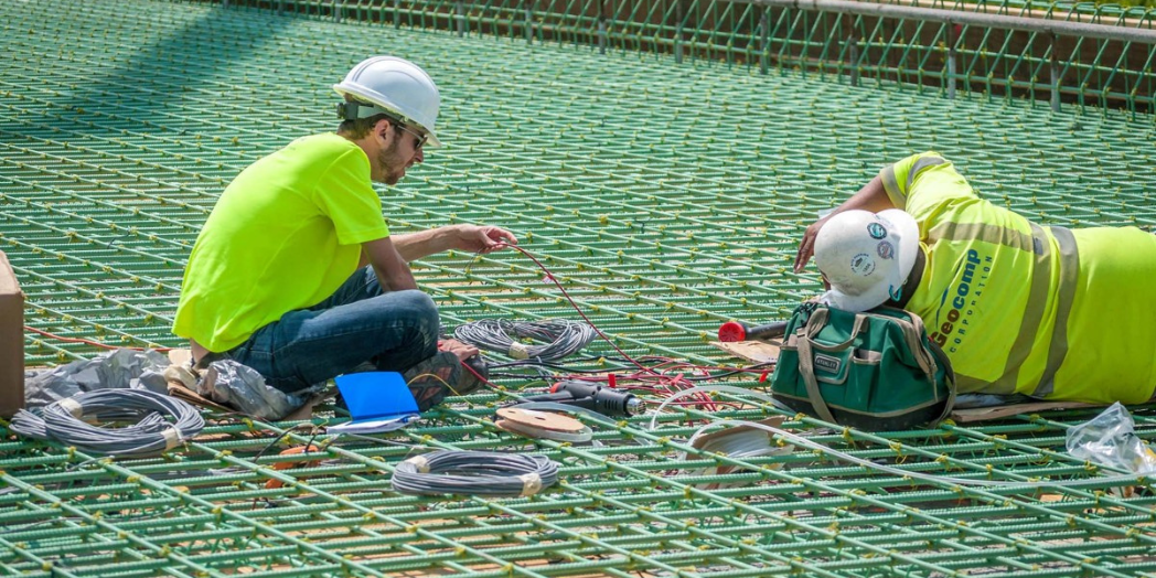 Individuals working on a bridge