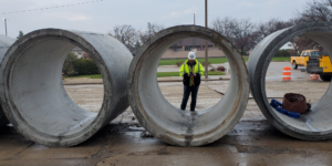 People in between concrete rollers 