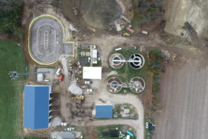 This aerial view shows a wastewater treatment facility under construction or undergoing upgrades.