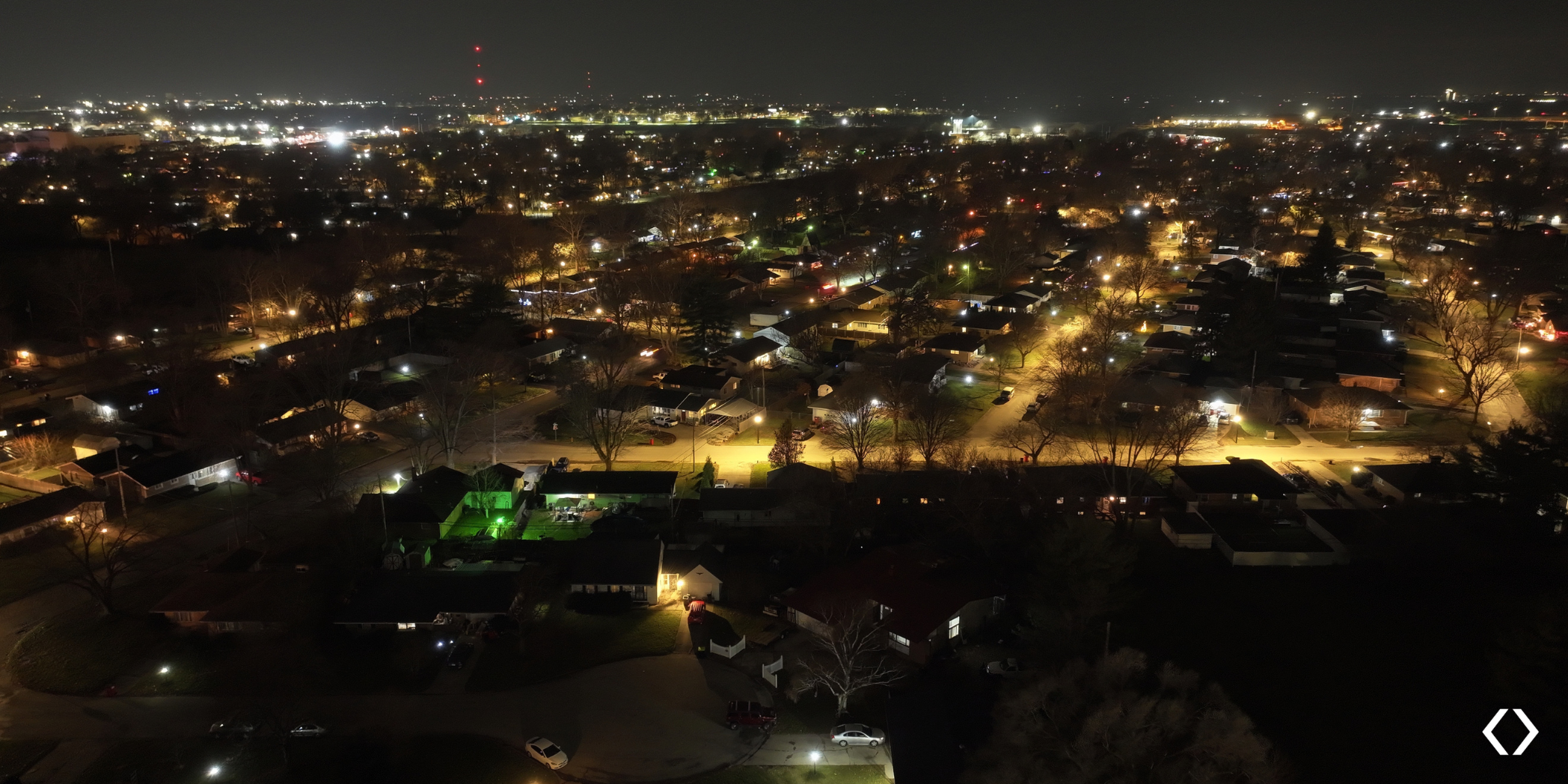Aerial image of Garden Hills improved lighting at nighttime.