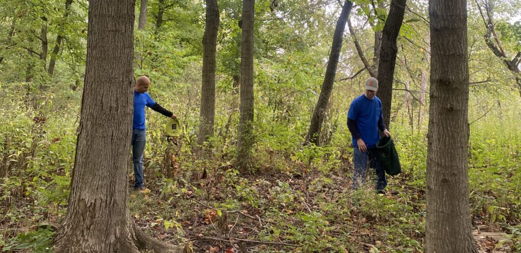 Chris volunteering at forest preserve cleanup.