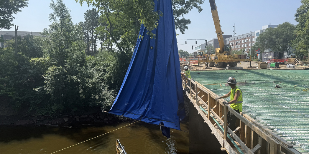Harrison Road Bridge Environmental Cloth being lowered into the river