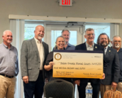 Sturgis council members and representatives gather with a ceremonial $4 million check for water plant improvements.