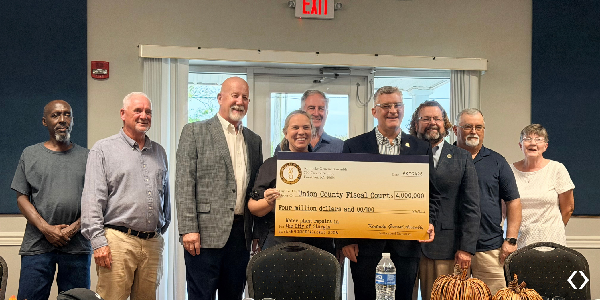 Sturgis council members and representatives gather with a ceremonial $4 million check for water plant improvements.