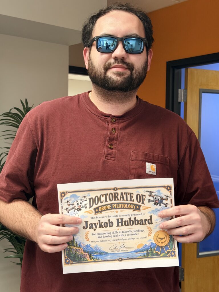 Jaykob Hubbard, PE, holding Doctorate of Pilotology certificate
